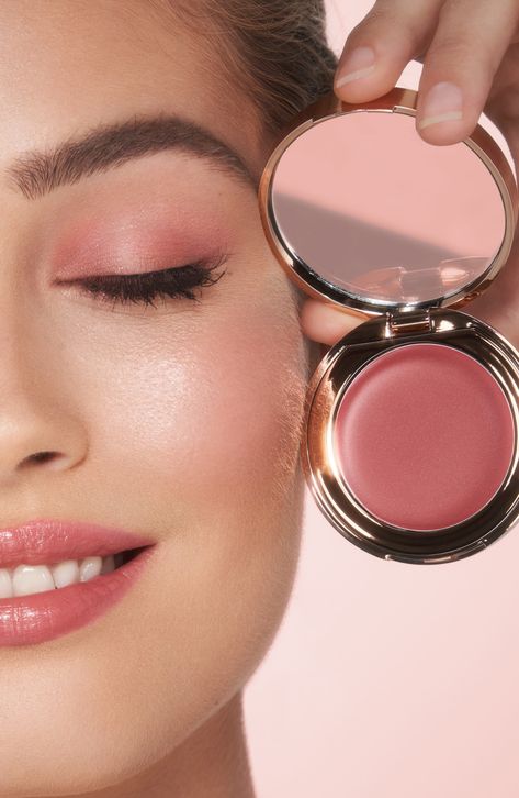 What it is: A hybrid lip-blush tint for weightless, buildable color. The easy-to-use cream formula glides on effortlessly for a dewy, sun-kissed glow.What it does: Charlotte's secret to sun-kissed skin in seconds. This multi-use, buildable product adds the perfect wash of color to the lips and cheeks. Infused with skin-loving ingredients like vitamin E and raspberry leaf stem cell extract, it moisturizes and revitalizes the look of skin. How to use: For a blush of color, apply to the apples of t Blush And Lipstick In One, Dewy Skin Aesthetic, Charlotte Tilbury Lip And Cheek Glow, Blush Photoshoot, Sun Kissed Blush, Best Cream Blush, Charlotte Tilbury Blush, Blush Aesthetic, Blush Tint