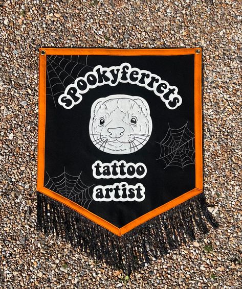 Custom Banner for @spookyferrets 👻 I love custom designs because it’s more of a collaboration. It’s so much fun to work with themes that are unique and something I could never come up with on my own. The ferret face and cobwebs are digitised by me and then embroidered out. The text was cut and sewn on to create a layered effect. We will both be attending @inkandenginesfest in a few weeks so come and say hi 🙋‍♀️ Email or DM for more details on commissions 💌 thehuffingdog@gmail.com #theh... Pennant Logo Design, Halloween Felt Pennant, Custom Pennant Flags, Framed Name Pennant, Halloween Pennant Flag, Custom Banners, Say Hi, Tattoo Artists, Custom Design