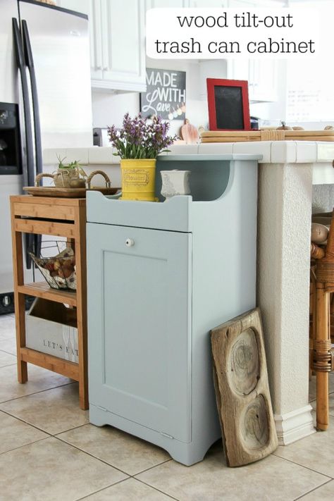 Often crafted from wood, these clever concealers add a country-chic accent to a kitchen, and the handheld tilt-out design means your bin is always easily within reach. This blogger repainted a cabinet she found a thrift store, but you can also DIY your own from scratch. Get the tutorial at Create Celebrate Explore » Hide Trash Cans, Can Cabinet, Garbage Can Storage, Trash Can Cabinet, Hidden Kitchen, Kitchen Trash Cans, Kitchen Renovation, A Kitchen, New Kitchen