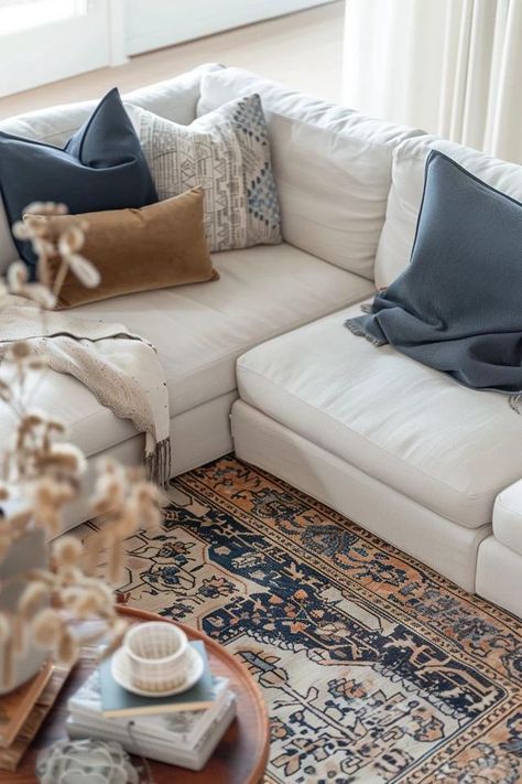 How To Place A Sectional On A Rug: Coordinated Living Space Rugs For Sectional Couch Size, Rug With A Sectional Couch, Light Colored Couch Living Room Ideas, Sectional Rug Placement Layout, Rug Sectional Placement, Rugs And Sectionals Placement, Sectional Sofa Rug Placement, Area Rug Under Sectional Couch, Light Sectional Living Room