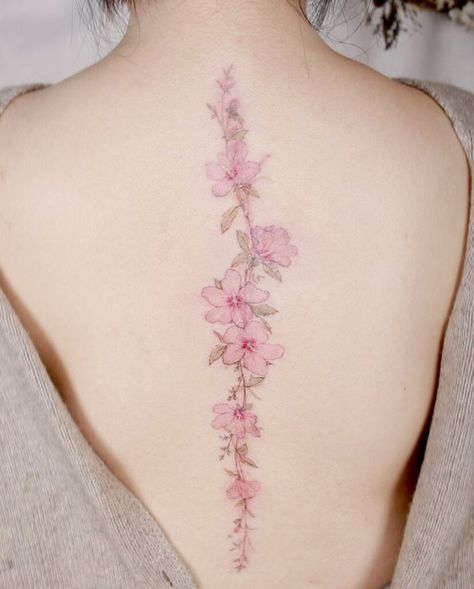 A beautiful blossom spine tattoo Back Tattoo Women Spine, Back Tattoos Spine, Floral Back Tattoos, Flower Spine Tattoos, Flower Tattoo Back, Tattoos For Women Flowers, Ornamental Tattoo, Spine Tattoos For Women, Back Tattoos For Guys