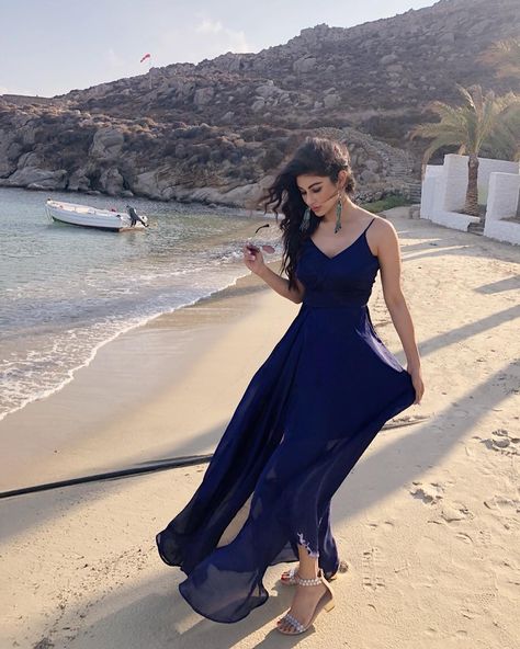 Mouni Roy, every fashion connoisseur's delight, is now taking over Greece with stylish shades of blue. And this time, it's a gorgeous maxi dress that's weaving the magic! Mouni Roy Dresses, Moni Roy, Gorgeous Maxi Dresses, Mouni Roy, Serial Actress, Indian Bridal Outfits, Blue Door, Indian Designer Outfits, Designer Dresses Indian