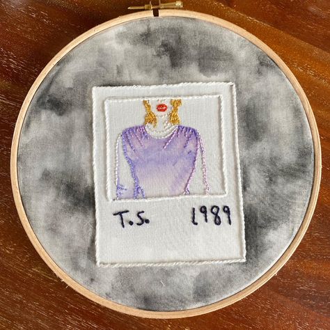 A Polaroid of Taylor Swift hand embroidered onto a dark cloudy background of grey watercolour stained fabric, with T.S. 1989 in black letters on it Taylor Swift 1989 Embroidery, Eras Embroidery, 1989 Embroidery, Polaroid Embroidery, Taylor Swift Embroidery, 1989 Cover, Taylor Core, Embroidery Fashion Detail, Painted Fabric