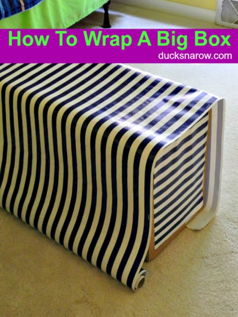 Big box with wrapping paper Packing Big Gifts Ideas, How To Wrap Oversized Gifts, Wrapping Large Presents, Gift Wrap Large Box Ideas, Wrapping A Box With Paper, How To Wrap Big Gifts, Wrapping A Large Gift, Gift Wrap Big Box Packaging Ideas, How To Wrap Large Boxes