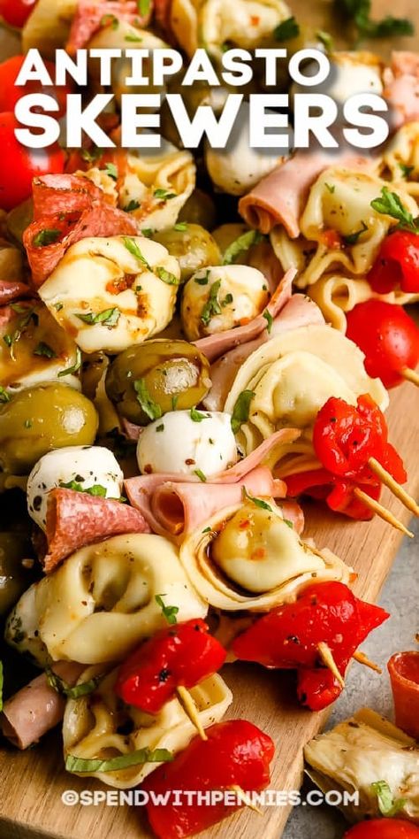 Antipasto Skewers are a fun, elegant way to serve appetizers at a party! Favorite meats, cheeses, tortellini, and olives are skewed and served with red or white wine! #spendwithpennies #antipastoskewer #recipe #appetizer #easy #italian