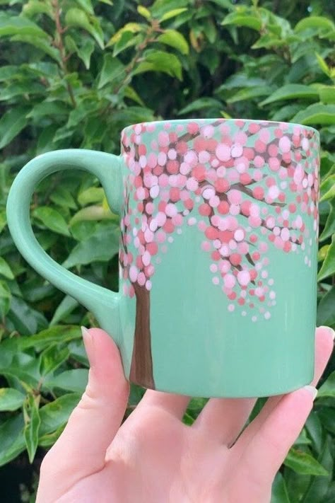 Hand painted cherry blossom themed mug! Hand painted, glazed and kilned by yours truly making this beautiful mug one of a kind! Great for all those nature lovers out there! Treat yourself or a loved one today with a mug that with inspire peace and tranquility and transport you to a magical place from right there in your sitting room! Free UK P&P + US shipping! Follow us on Instagram @mistymagpieshop Cherry Blossom Ceramic Painting, Cute Mug Painting Ideas Easy, Paint A Mug Ideas, Paint Your Own Mug Ideas, Simple Mug Painting Ideas, Easy Mug Painting Ideas, Diy Mug Painting, Cute Pottery Painting Ideas Mugs, Hand Painted Pottery Mugs