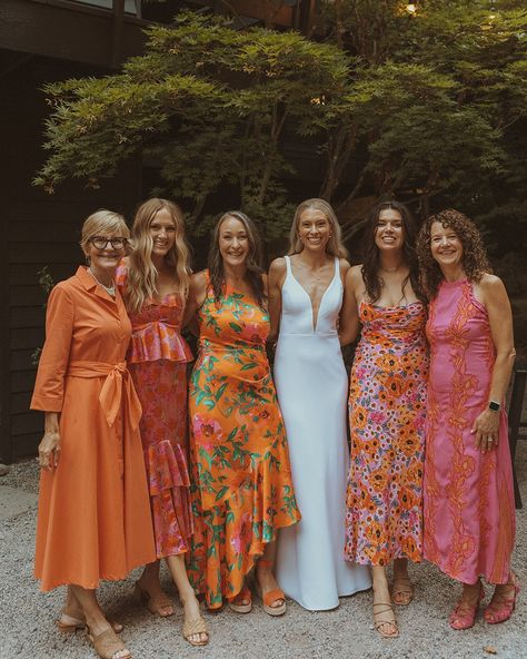 Happy one-year anniversary today to Sage and Zach! ⁠ This August wedding at JM Cellars featured a sleek, modern aesthetic with a unique orange and white color palette and touches of mid-century modern motifs. ⁠ ⁠ We adore the full commitment to the orange motif—with the bridal party in mixed dresses in a variety of orange floral and solid prints while the bride sported a sleek deep-v wedding dress and an all-orange bouquet! ⁠🧡✨ ⁠ 1960s-esk orange and white floral napkins also added a pop of p... Orange Floral Bridesmaid Dresses, Orange Bridal Party, White And Orange Outfit, Beach Formal, Happy One Year Anniversary, Orange Bridesmaid Dresses, Floral Bridesmaid Dresses, Bridal Theme, Mother Of The Bride Dresses Long