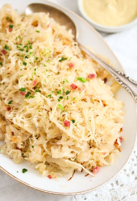 Bavarian sauerkraut – a regional way of cooking the famous German sauerkraut, with apples, bacon, cider, and caraway seeds. This is the perfect side dish for many German meat dishes. #whereismyspoon #bavariansauerkraut #germansauerkraut #sauerkrautrecipe #howtocooksauerkraut #germansidedish #sauerkraut #sauerkrautsidedish Crockpot Keilbasa Recipes, Bavarian Sauerkraut Recipe, Sourkrout Recipes, Sauerkraut With Apples, German Side Dishes, German Sauerkraut, German Meat, Curried Couscous, Rolls From Scratch