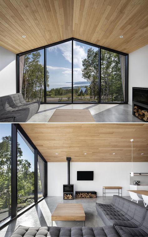 A Full Wall Of Windows At One End Of The Living Room Of This Home Allow For Impressive Water Views Vaulted Ceiling Ideas, Wall Of Windows, Black Accent Walls, Wood Exterior, Chalet Design, Modern Barn House, Open Plan Living Room, Barn Style House, Modern Barn