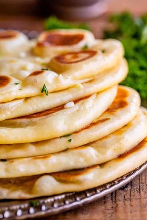 Homemade Naan Bread Recipe from The Food Charlatan. Make restaurant quality Naan Bread at home! If you have never tasted a fresh, tender, buttery homemade naan, you're totally missing out. I will show you just how easy this recipe is to put together and gives you the perfect receptacle for cleaning up all the curry on your plate! Naan Bread Recipe Sour Cream, Naan Bread Recipe No Yogurt, Naan Bread Recipe Easy, Easy Naan, Slow Cooker Beef Curry, Indian Bread Recipes, Naan Bread Recipe, Homemade Naan, Homemade Naan Bread