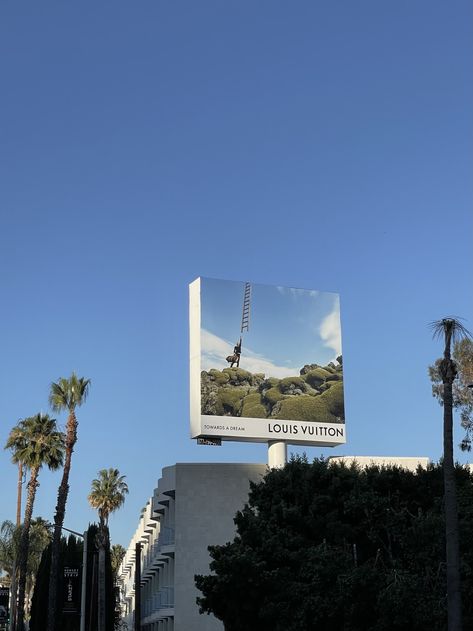 Louis Vuitton billboard Los Angeles blue sky advertisement Los Angeles Mood Board, Model Aesthetic Billboard, Aesthetic Billboard, Billboard Aesthetic, Louis Vuitton Commercial, Louis Vuitton Building Aesthetic, Los Angeles Aesthetic, Los Angeles Shopping, Boutique Interior