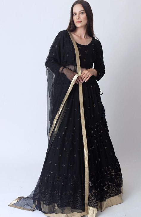 This luxurious Georgette Asha Black Lehenga Choli Set is a refined choice for special occasions that call for classy look. The black lehenga, crafted from premium georgette, features intricate all-over gold sequins embroidery. Complementing the tiered lehenga is a matching georgette blouse adorned with coordinating all-over gold sequins embroidery to create a harmonious look. The Asha Black Lehenga Choli set is completed with a black net dupatta that is beautifully accented with a golden border. The rich interplay of black and gold, combined with the premium georgette fabric, ensures a flattering fit and an effortlessly classy appearance of the Asha Sequins Embroidered Black Lehenga Choli Set. No. of Components: 3 Sequins embroidery on blouse & lehenga Blouse has hook & eye back closure Ti