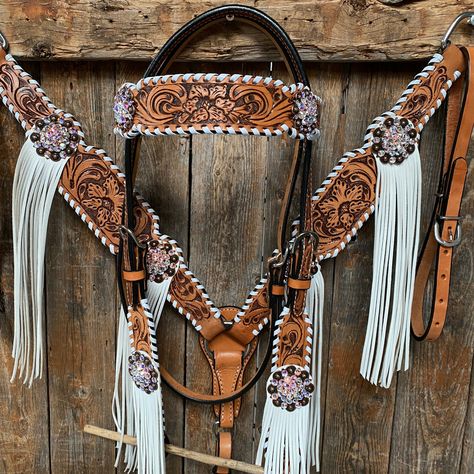 Browband, one ear, wither strap and breastcollar is floral tooled whipstitch style. They are decorated with copper AB crystal conchos/buckles and white fringe. Full Horse size Measurements Headstall measurements : bit to bit - 36" shortest setting : 44" longest settingBrowband measures 15" acrossBreastcollar measurements - From Center Ring to D Ring -16"Breastcollar including toggles : shortest settings - 26" : Longest settings -29" Lifetime guarantee on all crystals.Buy Together or Separate BRO Western Horse Tack Turquoise, Bling Tack Sets, Western Tack Sets, Barrel Racing Tack Rodeo, Bling Horse Tack, Horse Tack Accessories, Bling Tack, Wither Strap, Custom Leather Belts