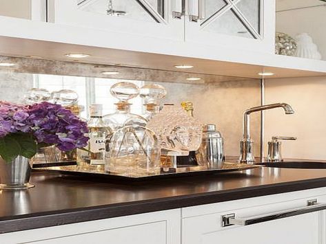 Blog about using a mirror backsplash look for your kitchen or wet bar remodel Mirrored Kitchen Backsplash, Mirror Backsplash Kitchen, Antique Mirror Backsplash, Mirrored Backsplash, Bandeja Bar, Farmhouse Backsplash, Beadboard Backsplash, Mirror Backsplash, Diy Backsplash