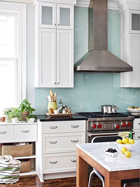 A single sheet of glass, painted on the back, lends color and easy-clean protection behind this range: http://www.bhg.com/kitchen/backsplash/kitchen-backsplash-ideas/?socsrc=bhgpin100714hardworkingwall&page=2