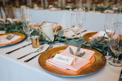 St. Petersburg Florida Wedding Venue | Red Mesa Events | Reception Long Banquet Feasting Tables | Wood Cross Back French Country Chairs | Greenery Garland Centerpiece with Gold Chargers and Blush Napkins | Gold Geometric Candles | Calligraphy Place Cards