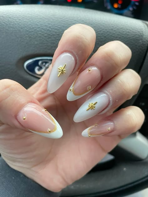 Fancy Oval Nails, White Grad Nails Almond, Nails White Gold Design, Almond Nails For Graduation, Xl Almond Nails Designs, Classy Nails Design Ideas Almond, Nail Inspiration With Charms, White French Tip With Gold Charms, Almond Nails Designs With Charms