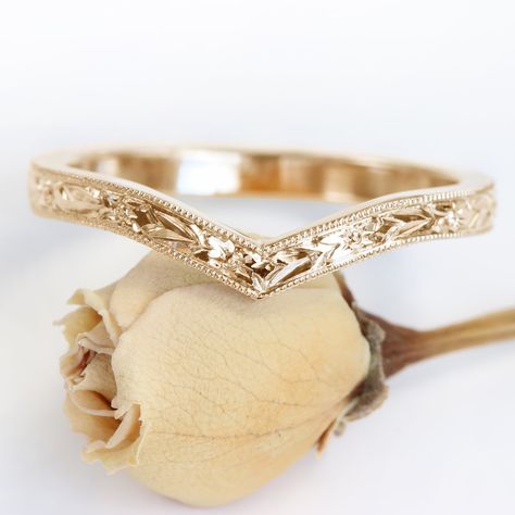 This pretty 18ct rose gold wishbone wedding ring is adorned with a detailed hand engraved orange blossom pattern around the band. The floral design is bordered with a milgrain edging. The 2mm wide x 1.5mm deep wedding band is handmade to order in Lilia's Cornish studio, from ethically sourced solid rose gold Wishbone rings look great on their own or in a ring stack - chevron dip can accommodate our solitaire and trilogy engagement rings (especially the rings with a milgrain setting). Get the per Floral Wedding Bands, Ethical Wedding, Trilogy Engagement Ring, Contour Wedding Band, Stacked Wedding Bands, Wedding Band Engraving, Plus Size Rings, Cute Engagement Rings, Engraved Wedding