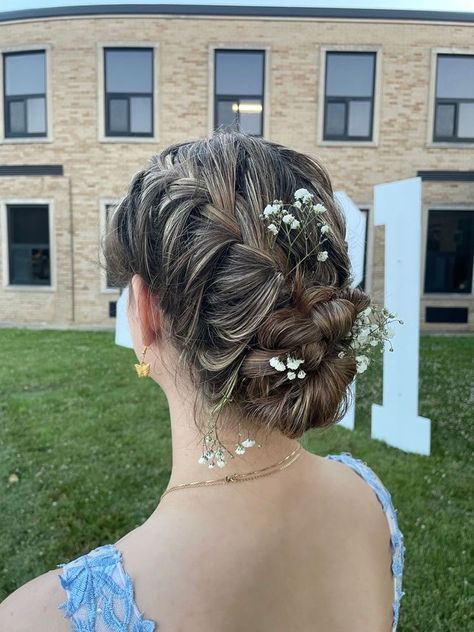 Messy Low Bun Hairstyles Prom, Formal Hairstyles Flowers, Prom Hair Updo With Braid, Braided Bun For Prom, Prom Hairstyles French Braid, Grad Updo Hairstyles, Flowers In Bun Hairstyles, Low Bun Hairstyles With Flowers, Low Prom Hairstyles