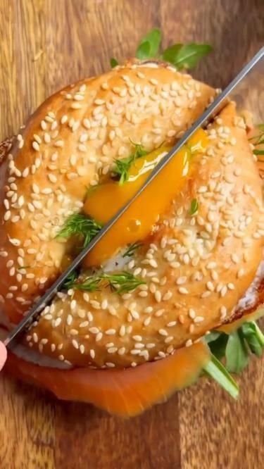 bagel sandwich that is specifically designed for breakfast, with ingredients such as eggs, bacon, cheese, and vegetables. The bagel itself may be toasted and seasoned with various spices and herbs to enhance its flavor. #recipe #foodie #healthy #easyrecipes #quickrecipes #dinnerideas #mealprep #vegetarian #vegan #glutenfree #paleo #lowcarb #dessert #appetizer #slowcooker #instantpot #mealplanning #budgetmeals #comfortfood #brunch Sandwich Bagel, Healthy Bagel, Bio On Instagram, Bagel Breakfast Sandwich, Bagel Toppings, Salmon Bagel, Breakfast Bagel, Mobile Website, Breakfast Brunch Recipes