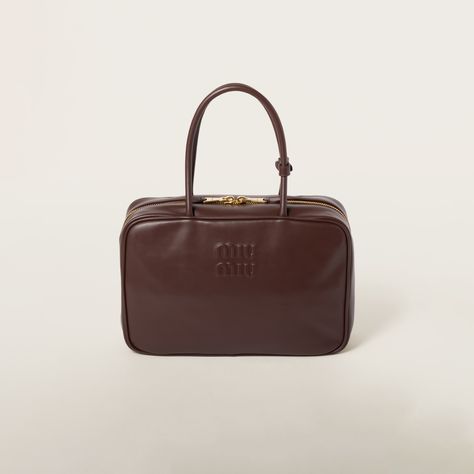 The nuance and details such as the gold-tone hardware stand out on the soft, smooth leather of the Beau bag, while the embossed lettering logo completes the design with an iconic note. Luxury Classic Miu Miu Bags, Academia Bag, Elegant Brown Miu Miu Bag, Dark Academia Bag, Brown Miu Miu Bag With Gold-tone Hardware, Luxury Miu Miu Bags With Zipper Closure, Luxury Miu Miu Bag With Gold-tone Hardware, Miu Miu Handbags, Miu Miu Bag