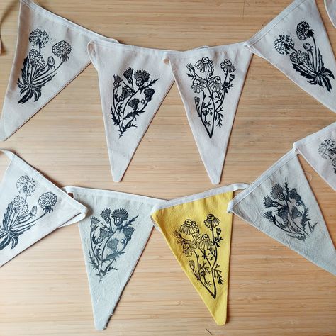 Organic cotton bunting with Lino printed British flowers on each flag. About 2 metres in length each.  There are two options, uncoloured fabric or coloured fabric. The colourful bunting has a a combination of yellow, green and white flags. The colours are from natural dyes, turmeric and spinach, which I've dyed myself. Please let me know which option you would like at the checkout.  I've had finished all the bunting myself. These really have been a labour of love.  If you have any other question Colourful Bunting, Community Gardens, British Flowers, Lino Print, Labour, Natural Dyes, Green And White, Bunting, A A