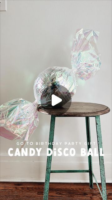 Jessica Garvin on Instagram: "Interrupting holiday content to share this easy & affordable birthday gift idea (although I suppose Santa could totally bring this too!!). My girls give these as gifts to their friends all year round! Wrap an 8 or 12 inch disco ball in iridescent paper & twist the ends to make it look like a jumbo piece of candy! 🍬🪩🍬 Always a show stopper & almost too pretty to unwrap!! Links to disco ball & wrapping paper at the link in my bio!" Jessica Garvin, Candy Christmas, Disco Balls, 10th Birthday, Disco Ball, Christmas Candy, Wrapping Paper, My Girl, Birthday Gift