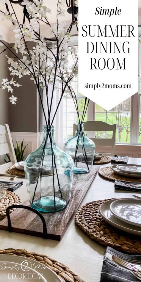 Faux Greenery In Glass Vase, Large Bottle Decor Glass Jars, Modern Farmhouse Vase Decor, Summer Centerpieces For Dining Room, Large Island Centerpiece Ideas, Large Glass Jar Ideas, Large Floral Centerpieces, Summer Dining Room Table Decor, Large Table Centerpieces