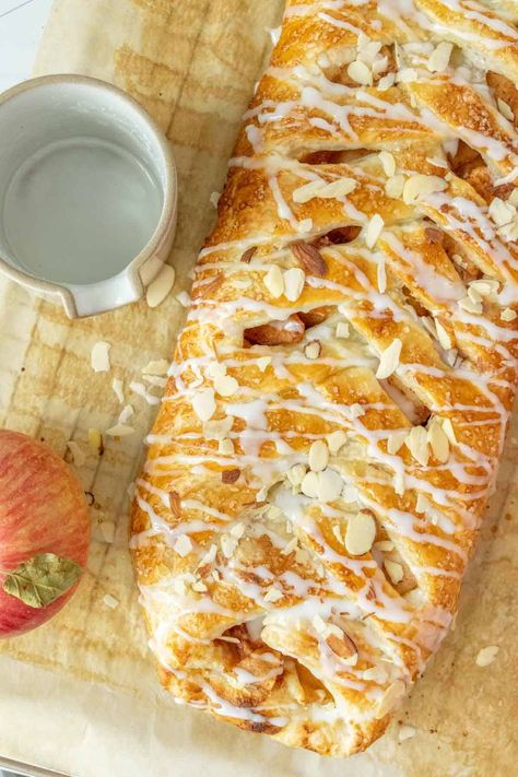 Filled with apples, cinnamon, and sweetened cream cheese, this delicious apple danish is perfect for a cozy fall breakfast or dessert. Apple Kringle Recipe, Apple Danish Puff Pastry, Apple Cheese Danish, Apple Cream Cheese Danish, Peach Danish, Apple Danish Recipe, Impressive Breakfast, Sweet Puff Pastry Recipes, Apple Danish