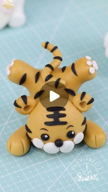 shaniabelle fondant on Instagram: "🐯How to make a tiger cake topper 🐯Gum paste from qeleg.com 🐯Feel free to contact me if you’re interested in any tools i have used.  Follow @shaniabelle_cake for more stunning cake ideas and hacks    #caketopper #tutorial #babyshowerideas  #inspirational  #genderreveal  #foodphotography #foodphotographyandstyling #reelsinstagram #foodgasm #tasty #dessert #video #inspiration #instagood #reels #cakeart #sugarart #cakeideas #LoveCelebration #BeautifulMoments #fondant #fondantcake" Tiger Fondant Topper, Tiger Cake Ideas, Tiger Fondant, Tiger Cake Topper, How To Use Fondant, Tiger Cake, Fondant Figures Tutorial, Fondant Tools, Tasty Dessert