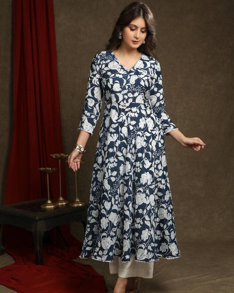 Elevate your style with our Exquisite Navy Blue Floral Printed Kurta. The A-Line Flared design is highlighted with beautiful lace detailing. This versatile piece can be worn as a kurta or paired with the optional pant for a complete look. Crafted with quality materials, it offers both comfort and elegance. #sujatra #sujatraglobal #sujatrakurtis #floralkurta #printedkurta #floralprint #alinekurta #flared #lacedetails #cottonkurta #floralcotton #cottonprints Flared Kurti Designs, Flared Kurti, Kurti Pant, A Line Kurta, Kurtis With Pants, Lace Pants, Embroidery Neck Designs, Dress Design, Kurti Designs