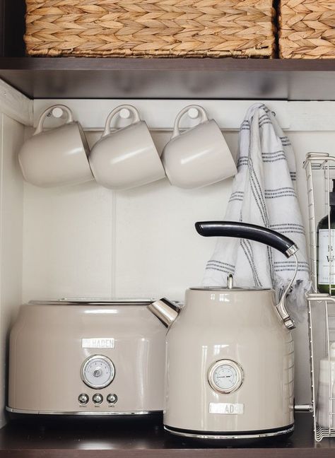 shelves with mug rack and tea kettle and toaster Cottage Pantry, Lily Pad Cottage, Cottage Storage, White Kettle, French Inspired Kitchen, Home Is A Feeling, Kettle And Toaster Set, Kitchen Countertop Decor, Warm Minimalism