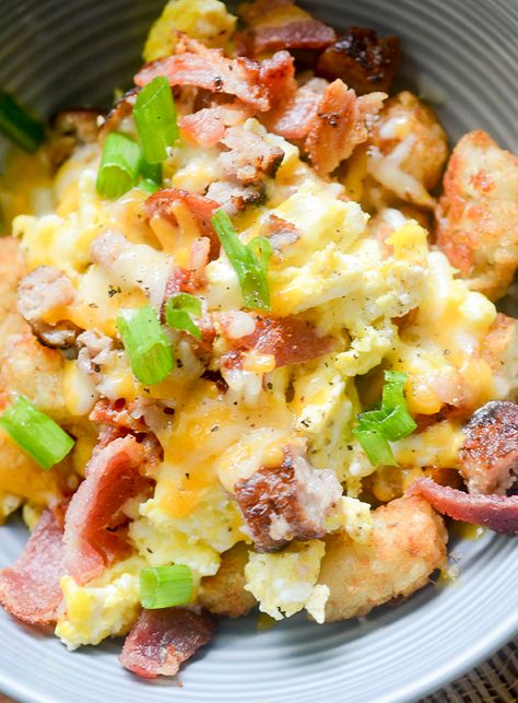 Jump to Recipe·Print Recipe Country Breakfast Bowl – a hearty breakfast bowl topped with scrambled eggs, bacon, sausage and melted cheese on top! Ever eaten at Perkins before? They have this dish there called Country Breakfast Bowl. It’s got everything your heart loves about breakfast food. Eggs, Tator Tots, bacon, sausage, and to make it … Burritos Vegetarian, Freeze Breakfast, Burritos Healthy, Burritos Freezer, Scrambled Eggs Bacon, Freezable Breakfast, Sandwiches Breakfast, Bacon Potatoes, Potato Breakfast Recipes