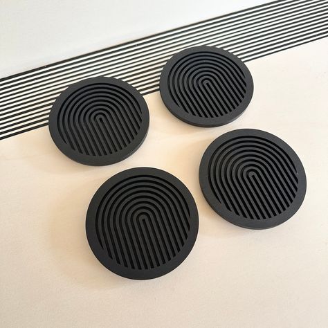 Introducing our set of 4 black geometric coasters, perfect for protecting your furniture while adding a touch of modern style to any room. Each coaster is lovingly handmade in Milton Keynes, England from sustainable plywood and laser cut to create a unique and striking design.Our coasters are crafted from two pieces of wood, with the top layer featuring a geometric cutout design and the bottom layer left plain black. Each coaster is approximately 11.5cm in diameter and 8mm thick (plus extra for . #LaserCutDecor #DIYDecor #HomeDecor #CraftIdeas #LaserCutting #HandmadeDecor Black Drinks, Laser Cut Furniture, Coasters Wooden, Coasters Wood, Geometric Coaster, Corporate Event Design, Black Coasters, Modern Coasters, Laser Cut Decor