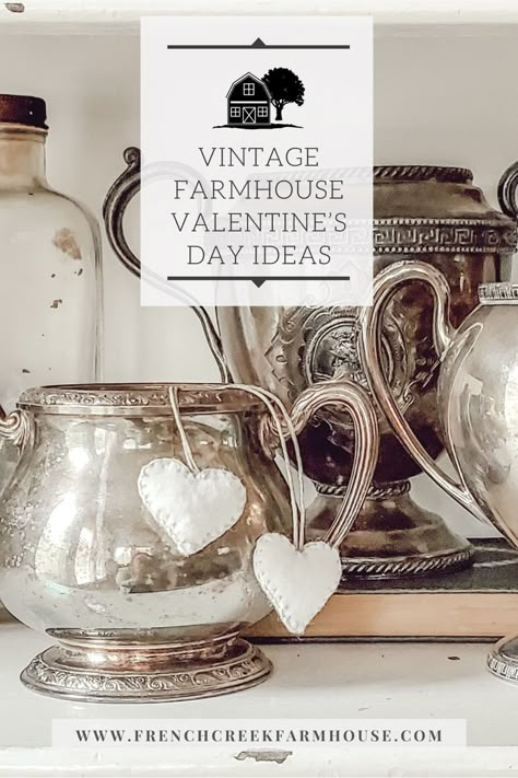 Elevate your Valentine's Day celebrations with vintage chic decor. Discover romantic ideas to create an ambiance of timeless elegance. #vintagevalentinedecor #vintagechic Shabby Chic Display Ideas, Vintage Suitcase Decor Display, Valentine’s Day Coffee Bar Ideas, Cottage Valentines Day Decor, Vintage Valentine Decorating Ideas, Valentine Cloches Decor Ideas, Neutral Valentine Decor Ideas, Valentine’s Day Tray Decor, Classy Valentines Day Decor