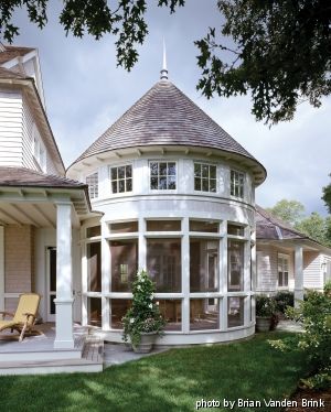 A rounded porch with conical roof and clerestory windows is reminiscent of the turrets of vintage shingle-style houses. House With A Turret, Turret Addition, Turret Room Ideas, Observatory Tower, 2020 House Plans, Turret Room, Turret House, Living Pool, Sunroom Addition