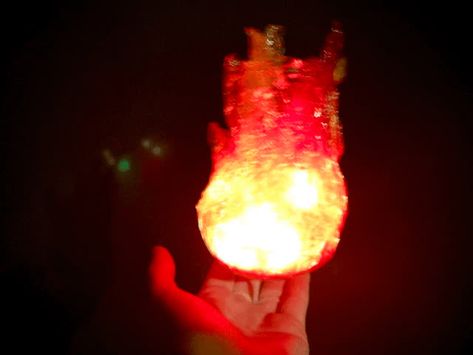 Make a glowing fireball that hovers above your hand. Attack your enemies by swinging your arm, and the fire flares up as your power surges. This is a very easy project that can add a lot of magic and fun interaction to your character. Fireball Costume, Flaming Shots, Fire Cosplay, Hades Costume, Fake Fire, Fire Torch, Witch Series, Super Mario And Luigi, Stationary Store