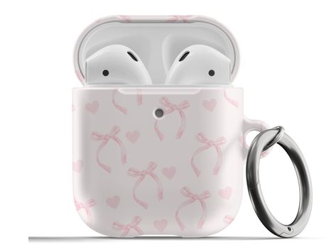 𝗗𝗘𝗦𝗖𝗥𝗜𝗣𝗧𝗜𝗢𝗡: Protect your AirPods with our Pink Ribbon Bows Hearts Coquette AirPods Case! This cute AirPods case features light pink bows and hearts on a pink background. ∙ Impact absorbing & scratch resistant case  ∙ Wireless charging compatible ∙ Glossy or matte finish ∙ 3-piece design ∙ Slim and lightweight ∙ Precisely aligned port openings ∙ Includes a metal carabiner ∙ Printed in the USA ∙ 360o protection from bumps, drops, and scratches Important note: Our AirPods Pro Case cover Cute Aesthetic Airpod Cases, Cute Pink Airpods Case, Bow Airpod Case, Coquette Airpod Case, Airpods With Case, Pink Airpod Case, Pink Airpods Case, Cute Airpod Cases, Air Pod Cases