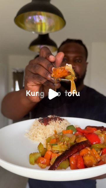 Ebenezer Odeniyi on Instagram: "KUNG PAO TOFU @veganezer

Ingredients:
Tofu:
- 280g blocks extra firm tofu 
- 1 tbsp soy sauce 
- 2-3 tbsp cornflour 
Veg:
- 1 medium onion, chunks 
- 1 red bell pepper, chunks 
- 1 green bell pepper, chunks 
- 2 celery stalks, chunks
- 2 small carrots, chunks 
- 5 garlic cloves, minced 
- 10 dried red chilli peppers 
- 1/2 cup roasted peanuts 
Sauce:
- 3 tbsp shaoxing wine 
- 2 tbsp vg oyster sauce 
- 2 tbsp soy sauce 
- 1 tbsp black vinegar 
- 1 tbsp chilli garlic sauce 
- 1 tsp sugar 
- 1/2 cup veg stock
- 1 slurry (1 tbsp cornflour & 2 tbsp water)

Method:
1. Cut the tofu into cubes then place in to a container with the soy sauce, allow it to marinate for 5-10 mins then add the cornflour and give it a shake. Ensure all pieces are coated. 
2. Make the sau Chilli Garlic Sauce, Kung Pao Tofu, Veg Stock, Black Vinegar, Chilli Peppers, Firm Tofu, Green Bell Pepper, Extra Firm Tofu, Chilli Pepper