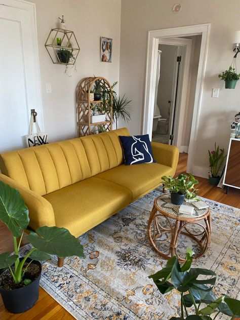 Mustard Futon Living Room, Yellow Living Room Couch, Yellow Vintage Couch Living Room, Yellow Aesthetic Living Room Decor, Yellow Couch Boho Living Room, Rug With Yellow Couch, Mid Century Modern Living Room Yellow Couch, Yellow Velvet Sofa Living Room Ideas, Yellow Apartment Decor Living Room