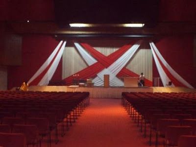 Simple Church Stage Designs | Feb 27 2011 Stage Backdrop Design Red and White Drapes at The Feast ... Reception Stage Backdrop, Church Stage Design Ideas Backdrops, Wedding Reception Stage, Backdrop Draping, Graduation Stage, Stage Backdrop Design, Draping Ideas, Reception Stage, Christmas Stage