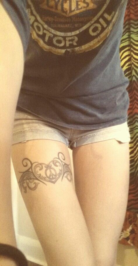 Fun garter tattoo Garter Tattoos, Lace Garter Tattoos, Thigh Garter Tattoo, Batman Sign, Peace Sign Tattoos, Tummy Tattoo, Garter Tattoo, Thigh Garter, White Ink Tattoo