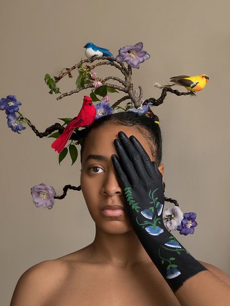 Model holding hand over her eye with birds, flowers, and branches in her hair. Nature Inspired Hair, Avante Garde Hair, Tree Hairstyle, Avant Garde Hairstyles, Unique Hair Styles, Hair Tree, Ethiopian Hair, Plant Hair, Afro Hair Art