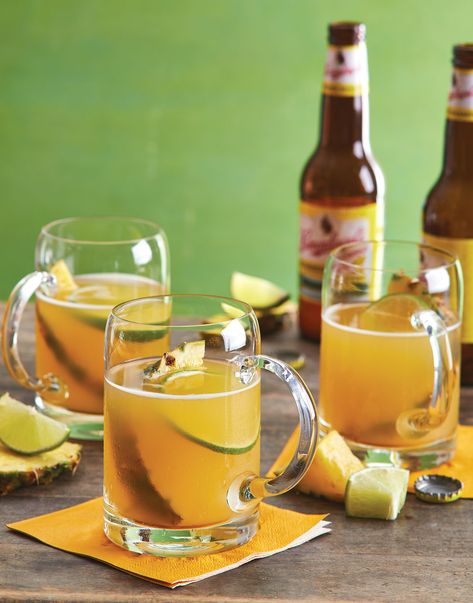 Tailgate Punch with Pineapple & Lime | This spiked beer punch is fruity and zesty, the best foil for a spicy tailgating menu. #cuisineathome #footballrecipes #gamedayrecipes #gamedayfood #tailgatingrecipes #footballfood #tailgaitingfood #superbowlfood #superbowlrecipes #superbowlparty #superbowlpartyideas  #food #recipe Tailgaiting Food, Beer Punch, Tailgate Menu, Cocktail Punch, Wine Cheese Party, Summer Shandy, Lemon-lime Soda, At Home Recipes, Party Spread