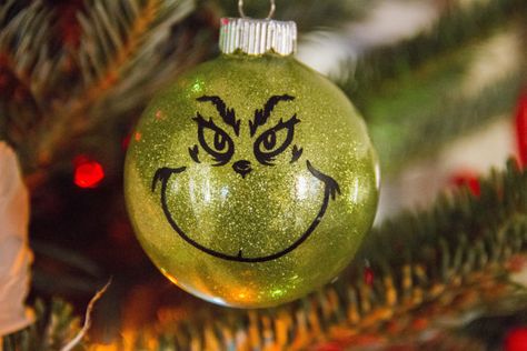 This is a 2.62 inch glass ornament with the glitter on the inside to avoid a mess. Comes complete with the face of one of our favorite Nerdy Christmas, Grinch Ornament, Der Grinch, The Grinch Christmas, Grinch Ornaments, Christmas Entertaining, Glitter Ornaments, Christmas Characters, Grinch Christmas