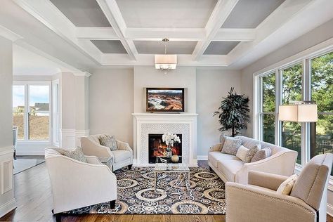 Contemporary living room with coffered ceiling wood flooring tv above fireplace Coffered Ceiling Paint Ideas, Coffered Ceiling Paint, Basement Ceiling Painted, Coffered Ceiling Design, Modern Moroccan Style, Walk In Closet Design, Tray Ceiling, Modern Moroccan, False Ceiling Design