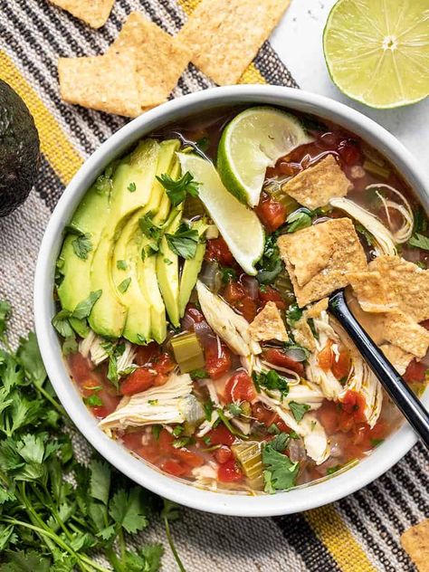 This Chicken and Lime Soup is light, fresh, and flavorful with shredded chicken, vegetables, fresh cilantro, and a tangy lime infused broth. BudgetBytes.com