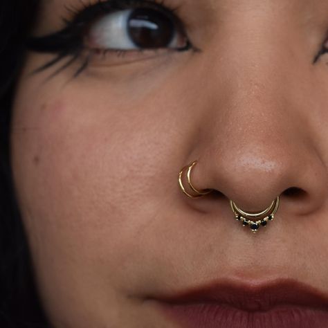 Nothing like a full upgrade ✨ Front and center we have the Throne continuous ring with genuine black diamonds from Tawapa 🖤 We stacked this luxe design with one of our 14k gold clicker rings for an extra boost • of course, we couldn’t forget about Kattia’s healed nostril piercings which we fitted with two 14k gold seam rings made by us. Come find your next look with us • Appointments for piercing + styling are live online at somaticbodypiercing.com Septum And Nostril Piercing, Septum Stack, Piercing Styling, Septum Nostril, Face Jewelry, Luxe Design, Face Jewellery, The Throne, Septum Piercing