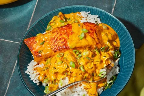 This coconut curry salmon from chef Eric Adjepong combines seared salmon with a curry sauce made with coconut milk, peppers, thyme, tomato, and onions. Coconut Curry Salmon, Curry Salmon, Coconut Curry Sauce, Madras Curry, Seafood Entrees, Shrimp Scallops, Salmon Seasoning, Seared Salmon, Food Fish