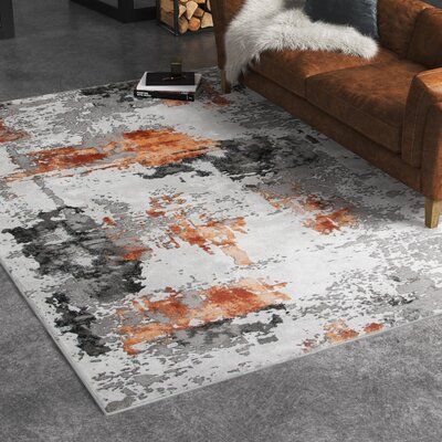 This area rug has abstract grey and orange patterns that create a modern and artful foundation on your floors. It's made from a blend of polyester and polypropylene, and it has a latex backing. We love how the simple ivory and light grey colour palette in the background works well with decors from industrial to classic. Plus, this rug has a medium 0.55" pile height that's easy to clean and ideal for rooms with high foot traffic like the living room or entryway. To keep this rug in place, we reco Vintage Style Rugs, Living Room Decor Gray, Living Room Orange, Grey Color Palette, Orange Area Rug, Green Area Rugs, Living Room Grey, Orange Grey, Orange Rugs